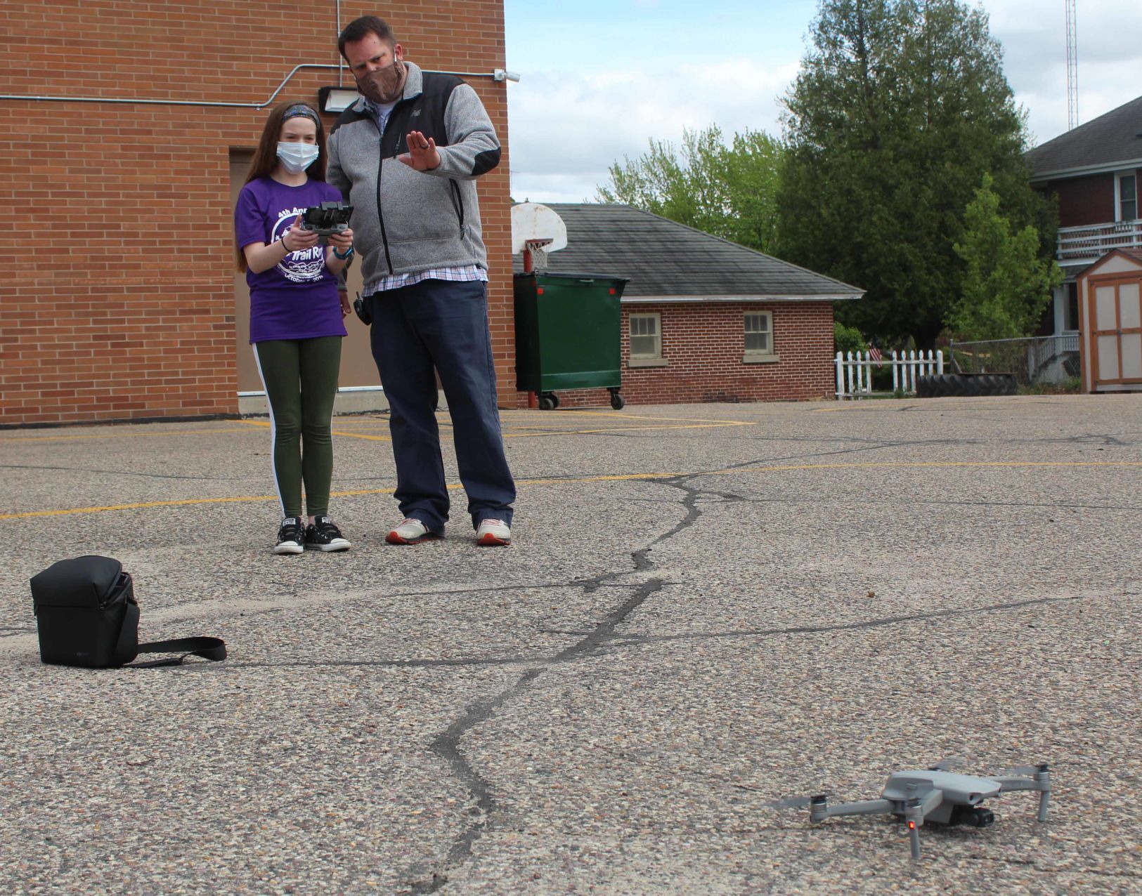 Matt helps student land drone